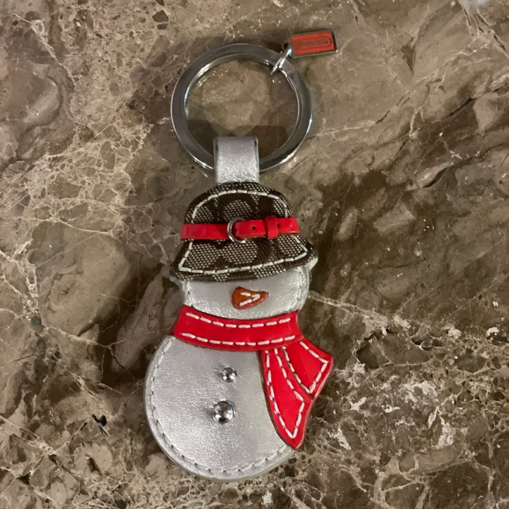 COACH Silver Snowman Wearing A Coach Hat Keychain Bag Charm With Red Accents
